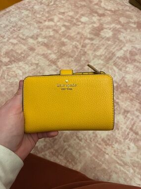 kate spade New York Yellow Pebbled Leather Wallet